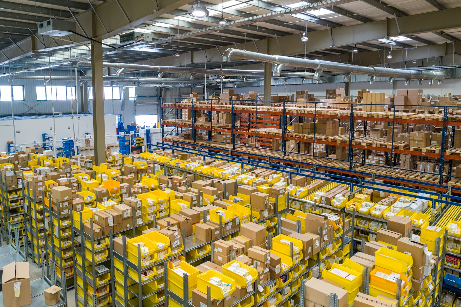Bright fulfillment warehouse with packed orders ready to ship